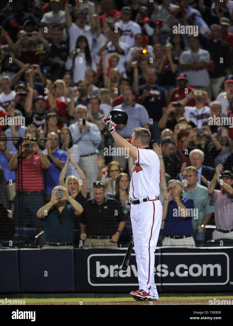 Retiring Atlanta Braves third baseman Chipper Jones salutes the