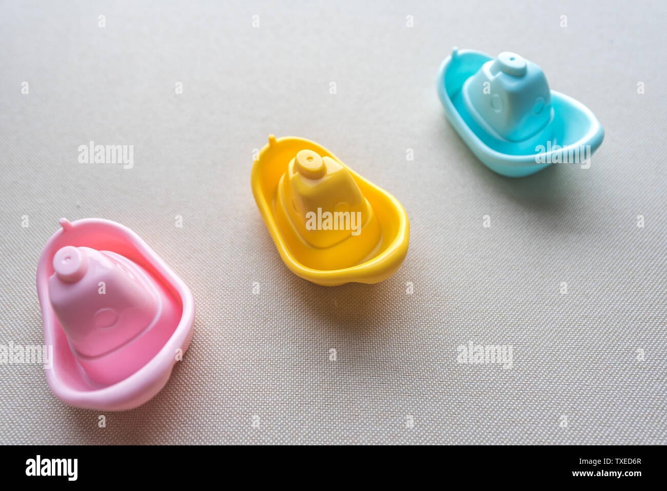 Red, yellow and blue boat toy Stock Photo - Alamy