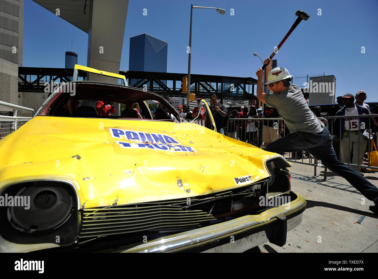 Mike King takes a sledge hammer to a 1976 AMC Pacer automobile for a charity promotion before Game 4 of the Atlanta Hawks and Indiana Pacers Eastern Conference NBA playoff series at Philips Arena in Atlanta, April 26, 2013. UPI/David Tulis Stock Photo