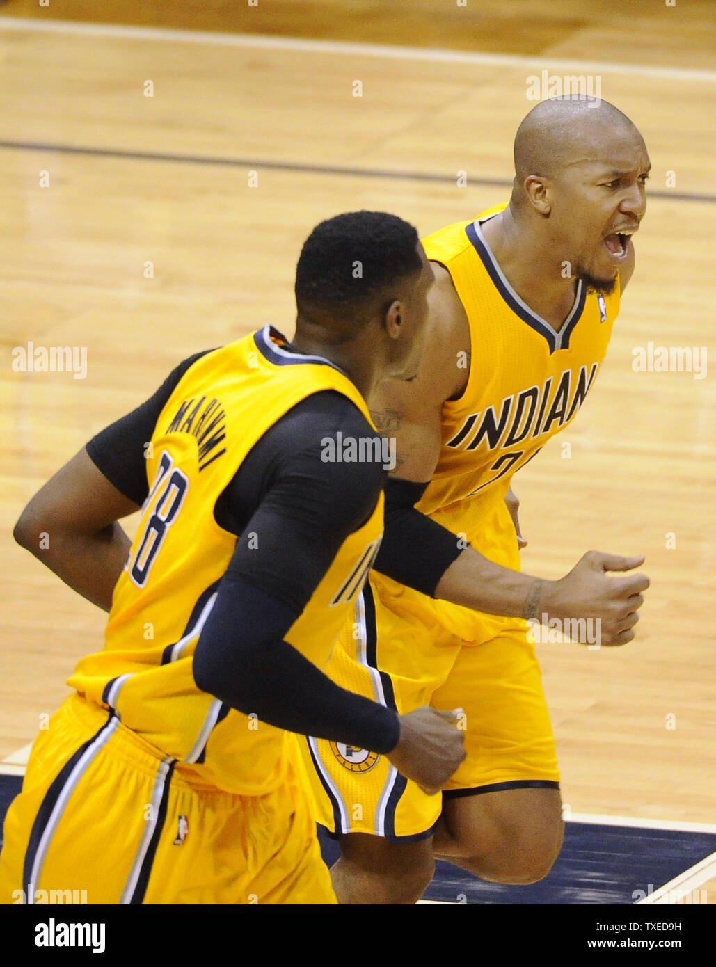 Indiana Pacers High Scorer Paul George R Reacts With Teammate Ian Mahinmi 28 After A Basket Against The Atlanta Hawks During The Second Half Of Game 6 In Their Eastern Conference Nba