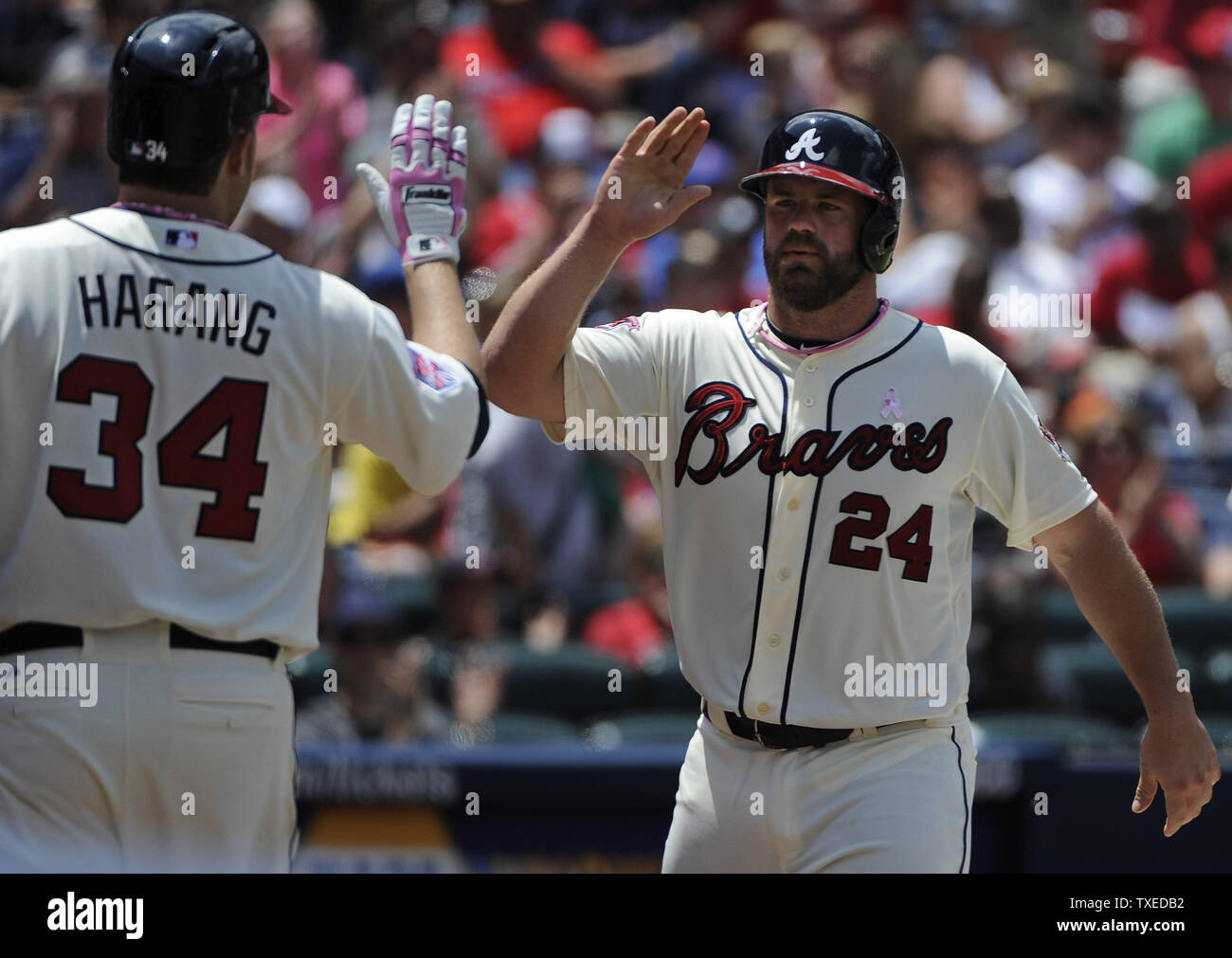 Atlanta Braves' Evan Gattis goes to first as he walked during the sixth  inning of a baseball game against the Washington Nationals, Sunday, June  22, 2014, in Washington. The Nationals won 4-1. (