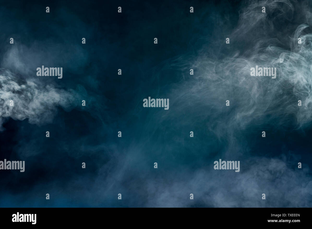 white smoke isolated in color blue and green background Stock Photo - Alamy