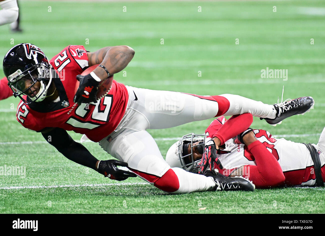 Atlanta Falcons wide receiver Mohamed Sanu (12) is tackled by Arizona Cardinals defensive back David Amerson (R) during the first half of an NFL game at Mercedes-Benz Stadium in Atlanta, December 16, 2018.  Photo by David Tulis/UPI Stock Photo