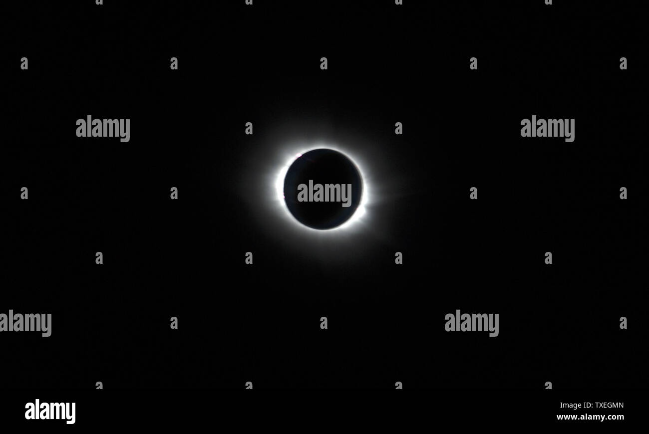 A total solar eclipse is viewed while flying on board a special flight operated by Transavia, from Schiphol Airport in Amsterdam, The Netherlands on March 20, 2015. A solar eclipse occurs when the orbit of the moon places it directly between the sun and earth. The moon's shadow darkens the skies for approximately two to three minutes as it traces a northerly path across the North Atlantic between Iceland and the European continent toward the north pole.  Photo by Joe Marino/UPI Stock Photo