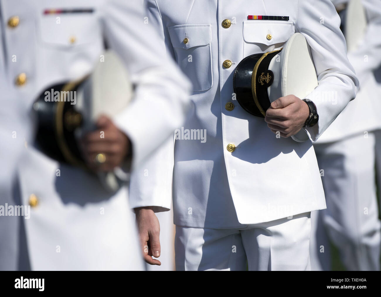 Midshipmen arrive for their Graduation and Commissioning ceremony at