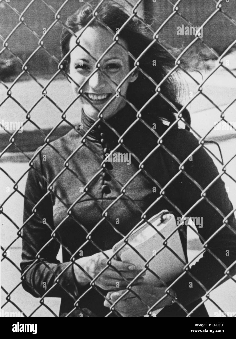 A photo taken of Miss Susan Atkins, convicted mass murderer, and once a member of the Charles Manson 'family'. She stands behind the fenced-in women's prison on August 20, 1981. She got married to self-described millionaire Donald Lee Baisure on September 2, 1981 in Frontera, CA. He turned out not be a millionaire at all and had been married 35 times already. She had the marriage annuled. (UPI Photo/Rich Lipski/Files) Stock Photo