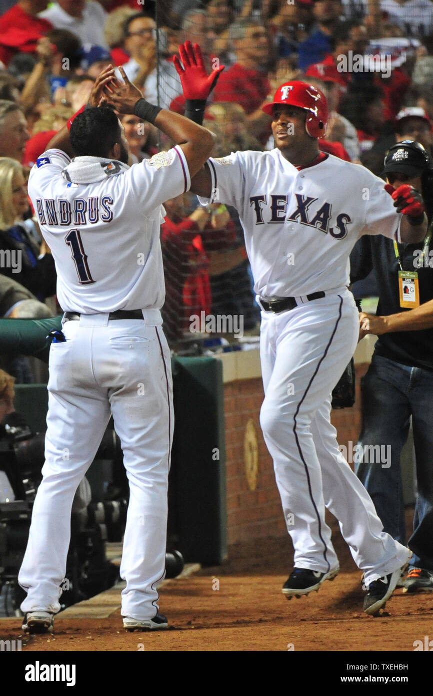 Texas Rangers Adrian Beltre (R) is greeted by Elvis Andrus (1