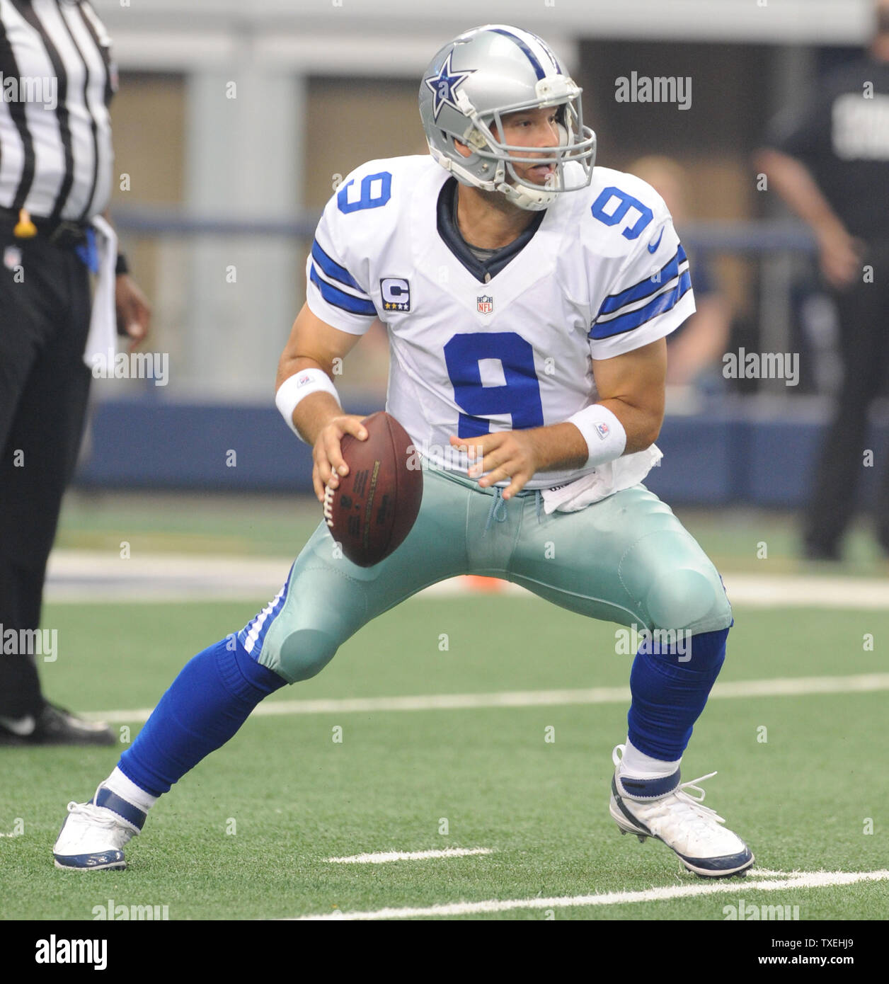 Dallas Cowboys quarterback Tony Romo scrambles out of the pocket during ...