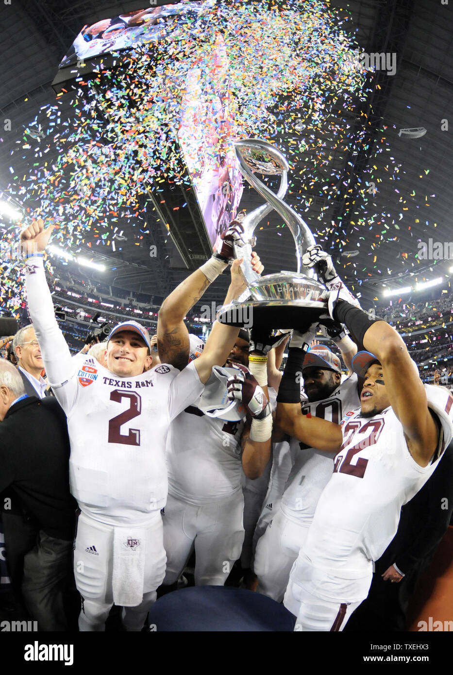 Texas A&M Aggies Johnny Manziel, left and teammates lift the Field Scovell Trophy after beating the Oklahoma Sooners 41-13in the 77th AT&T Cotton Bowl Classic at Cowboys Stadium in Arlington, Texas on January 4, 2013  UPI/Ian Halperin Stock Photo