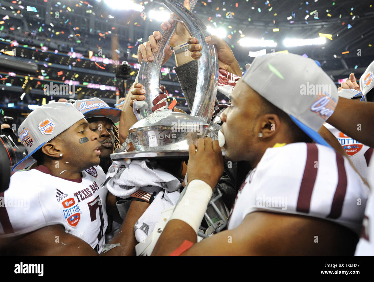 Texas A&M Aggies kiss the Field Scovell Trophy as they celebrate their 41-13 victory over the Oklahmoma Sooners in the 77th AT&T Cotton Bowl Classic at Cowboys Stadium in Arlington, Texas on January 4, 2013  UPI/Ian Halperin Stock Photo