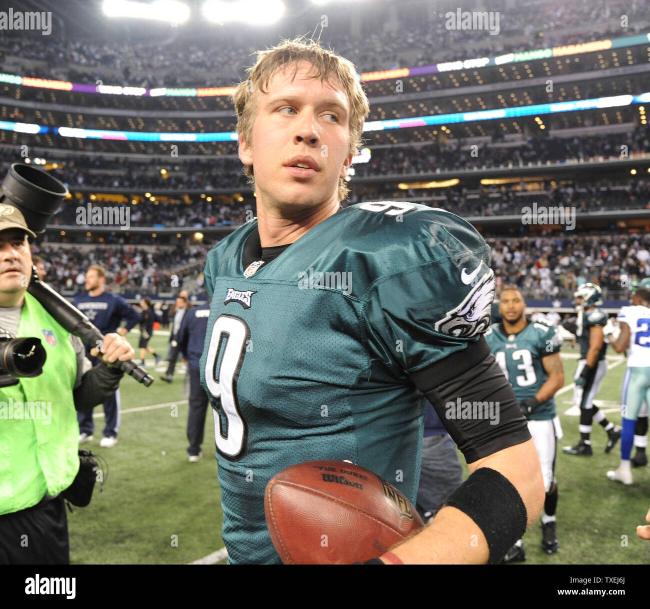 Philadelphia Eagles Nick Foles walks off the field following the Eagles  24-22 victory over the Dallas Cowboys at AT&T Stadium in Arlington, Texas  on December 29, 2013. With the win the Eagles