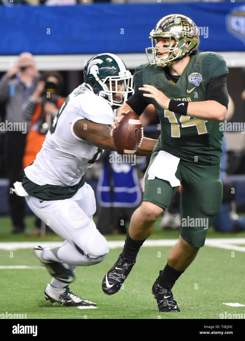 Michigan State's Shilique Calhoun pressures Baylor Bear's Bryce Petty during the second half of the Goodyear Cotton Bowl Classic in AT&T Stadium, Arlington, Texas on January 1, 2015.  The Spartans won 42-41. Ian Halperin/UPI Stock Photo