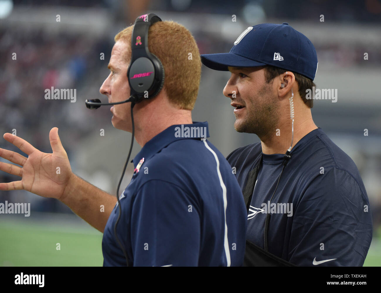 Dallas Cowboys Tony Romo, who is out with a shoulder injury, talks to ...
