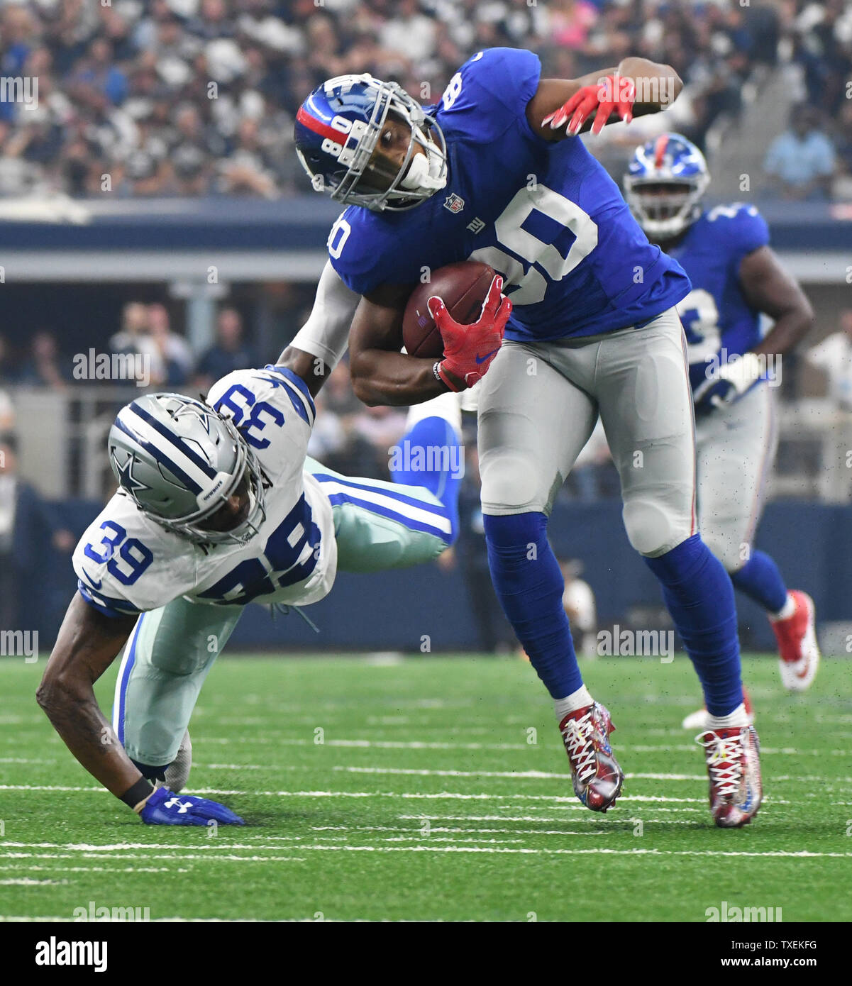 New York Giants Victor Cruz gets brought down from behind by Dallas Cowboys Brandon Carr during th first half at AT&T Stadium, Arlington, Texas on September 11, 2016.  Ian Halperin/UPI Stock Photo