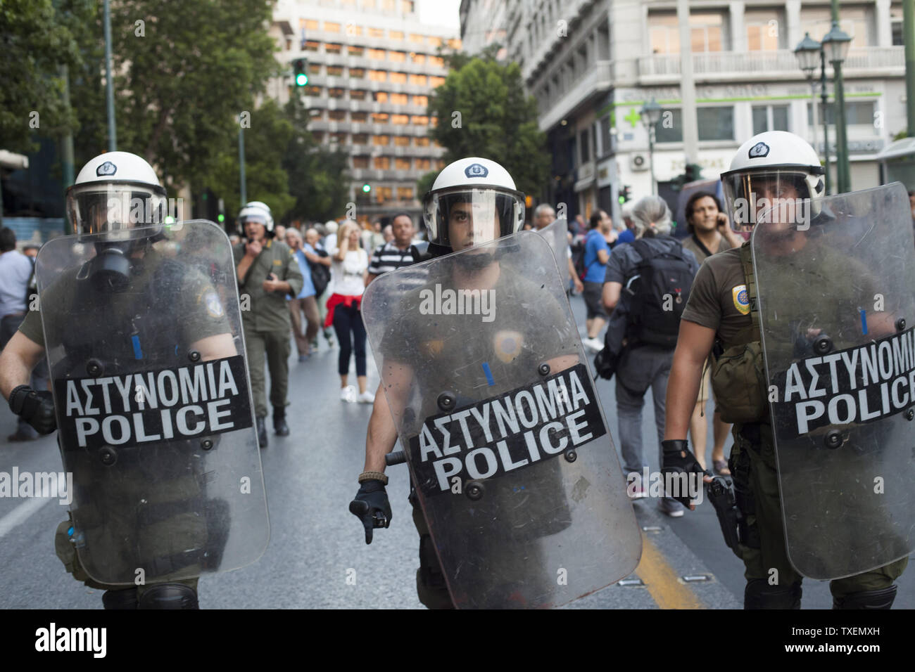 Greek riot police stop members of the radical left group Antarsya during their march against any austerity deal in Athens on July 10, 2015, while Greek lawmakers in parliament debate whether to support the prime minister's last-ditch reform plan that the government submitted to European creditors.  Greece will need to exit the Euro if a deal is not struck.  Photo by Dimitris Michalakis/UPI Stock Photo