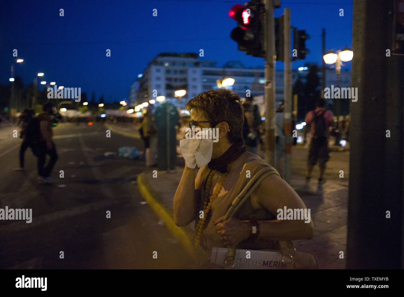 Clashes broke out between protestors and riot police during  protest against the new package of austerity measures to remain with the euro, in Athens, Greece on July 15, 2015.  The Greek Parliament passed controversial measures demanded by eurozone creditors in exchange for a new bailout to keep Greece in the Euro currency.   Photo by Dimitris Michalakis/UPI Stock Photo