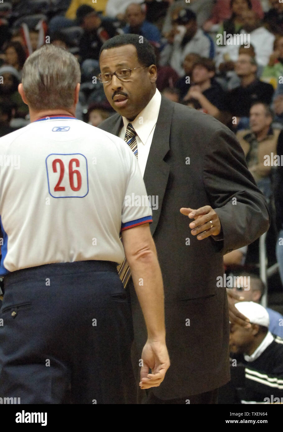 Atlanta Hawks coach Mike Woodson (R) has a discussion with an official in the first half in Atlanta's Philips Arena December 27, 2005. The Bobcats defeated the Hawks 93-90. (UPI Photo/John Dickerson) Stock Photo