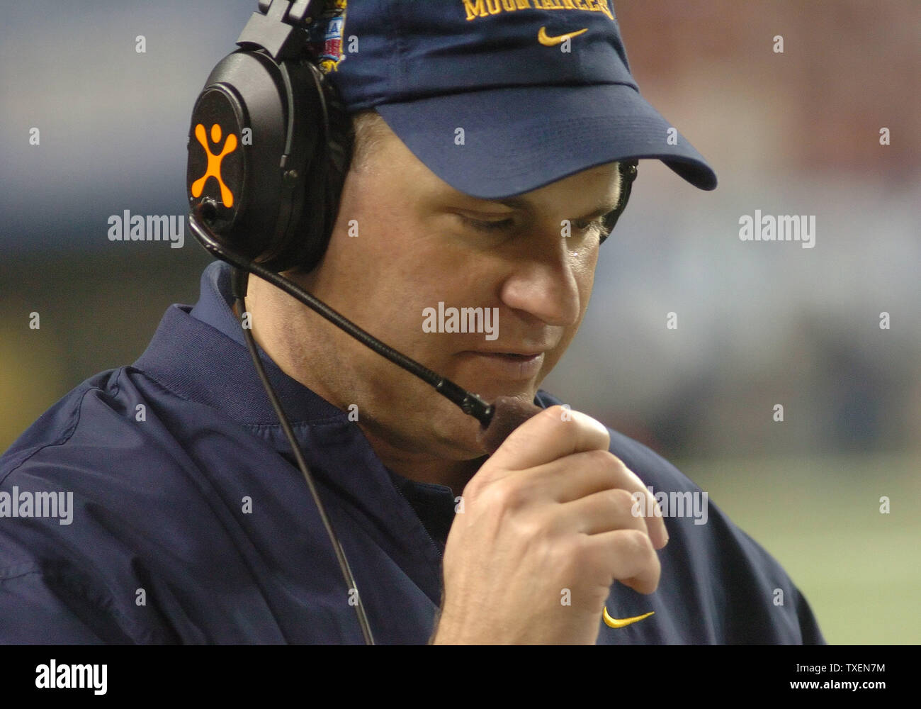 West Virginia coach Rich Rodriguez speaks with his staff during the first half of the Nokia Sugar Bowl in AtlantaÕs Georgia Dome, January 6, 2006. West Virginia defeated Georgia 38-35. (UPI Photo/John Dickerson) Stock Photo