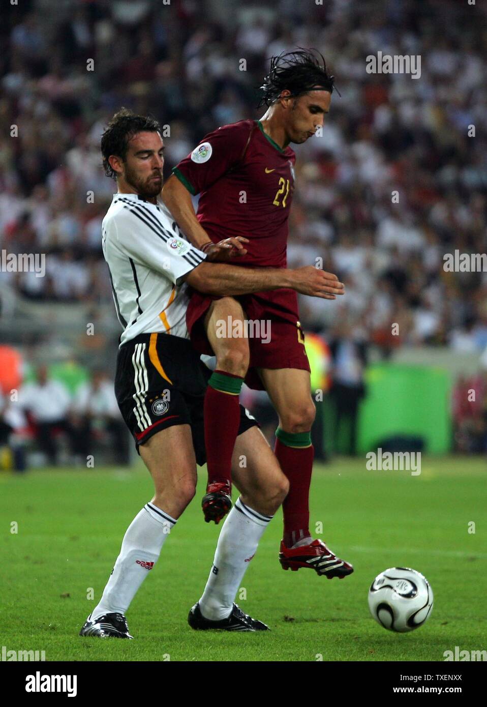 Germany's Christoph Metzelder (L) and Portugal's Nuno Gomes fight for the ball in 2006 FIFA World Cup soccer in Stuttgart, Germany on July 8, 2006. Germany defeated Portugal 3-1 to capture third place in the World Cup.  (UPI Photo/Christian Brunskill) Stock Photo