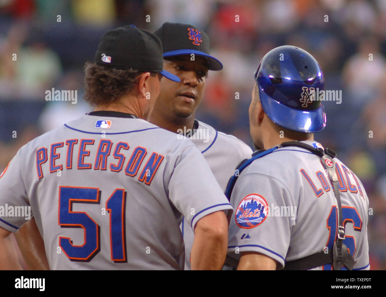 Florida Marlins starting pitcher Pedro Martinez meets on the mound with his pitching coach Rick