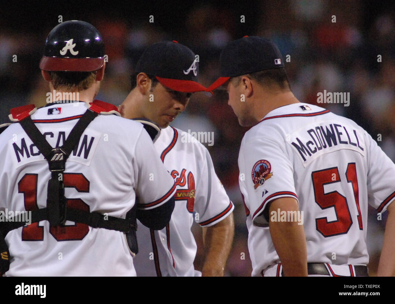 Atlanta Braves Jeff Francoeur (L) high-fives with teammate Brian McCann  after Francoeur's two-run homer in the sixth inning drove in McCann during  play against the visiting New York Mets at Turner Field