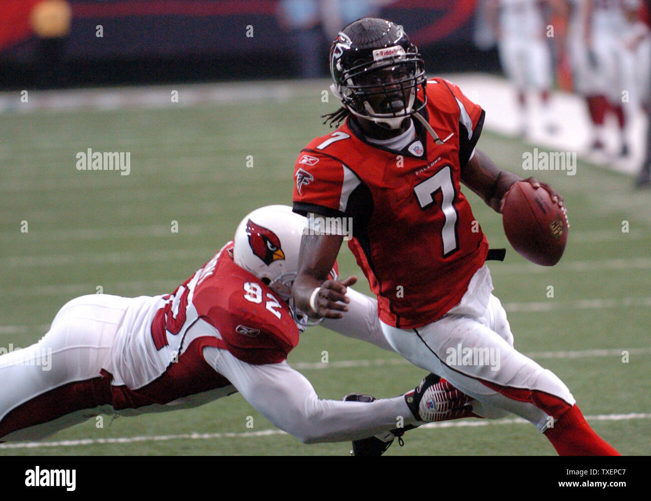 Atlanta Falcons quarterback Michael Vick (7) runs the option for a