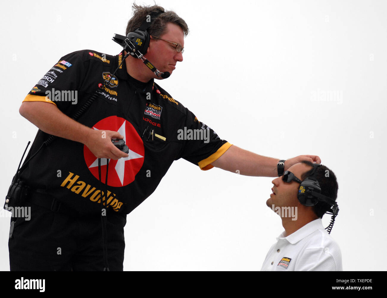 Juan Pablo Montoya (R), former Formula One driver in training for the