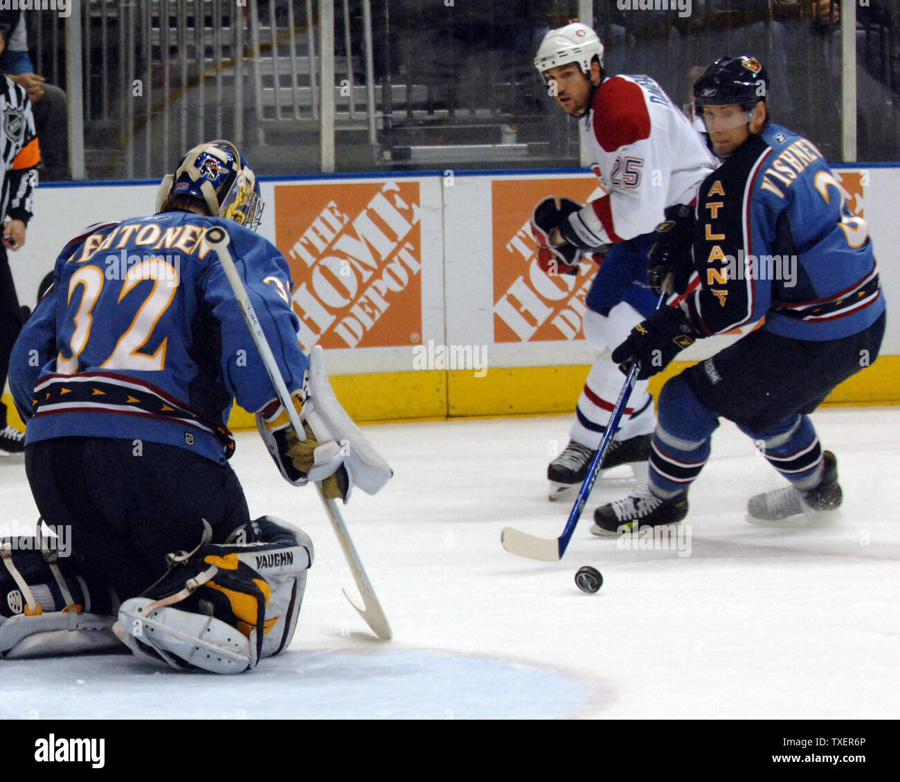 Atlanta Thrashers Vitaly Vishnevski (3) of Ukraine picks up the puck