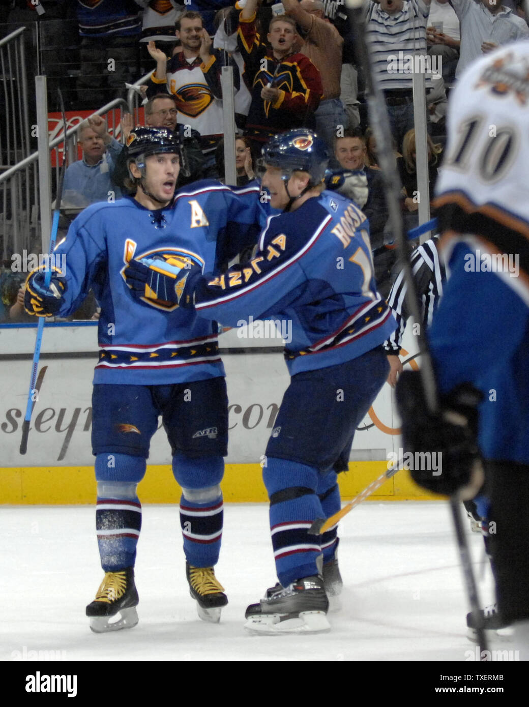 Atlanta Thrashers Vyacheslav Kozlov (13) of Russia is congratulated by teammate Marian Hossa (18) of Slovakia for a goal against the Washington Capitals in the first period at Philips Arena in Atlanta, March 12, 2007. (UPI Photo/John Dickerson) Stock Photo
