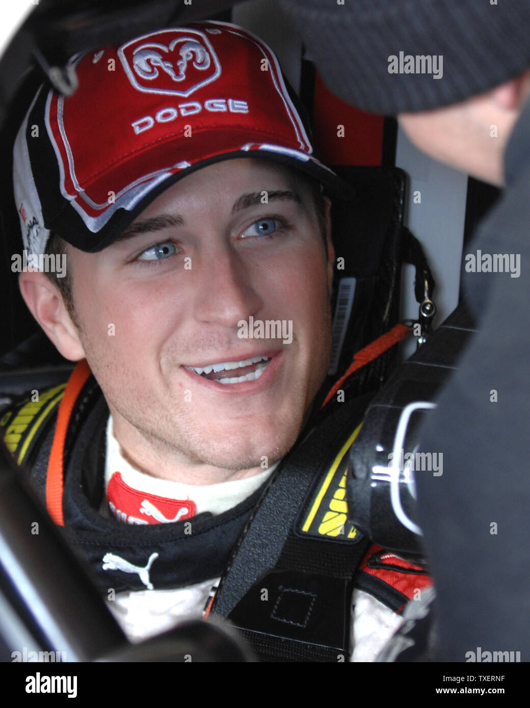 NASCAR Nextel Cup driver Kasey Kahne sits in his car and talks with a crew member before the morning Kolbalt Tools 500 practice session at Atlanta Motor Speedway in Hampton, Georgia, March 17, 2007. (UPI Photo/John Dickerson) Stock Photo
