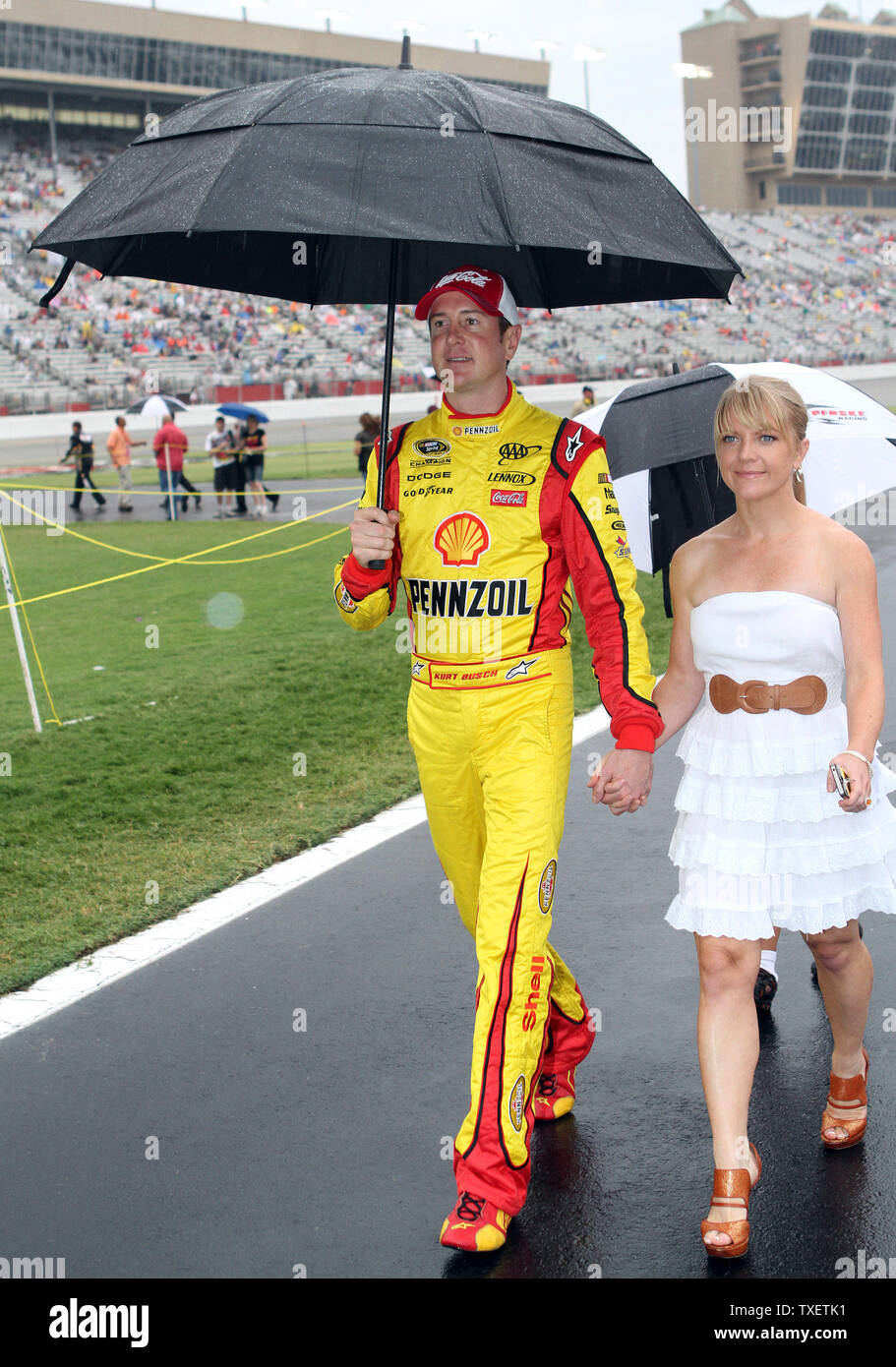 Kurt Busch and his girlfriend Patricia Driscoll walk to drivers  introductions prior to the start of the rain delayed 52 Annual AdvoCare 500  at Atlanta Motor Speedway Speedway in Hampton, Georgia on