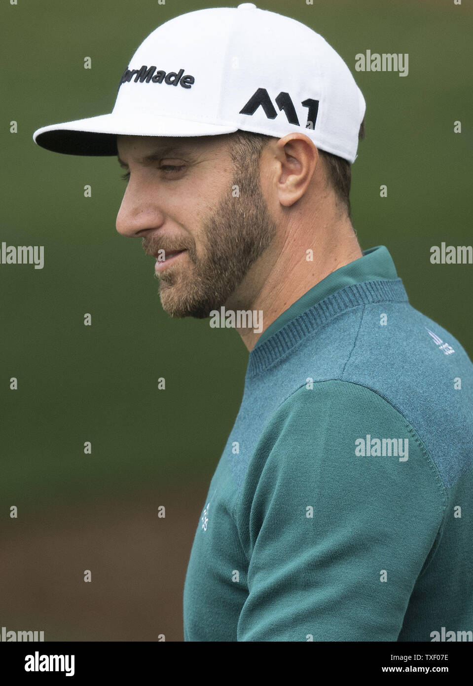 Dustin Johnson is seen on the practice range prior to his first round