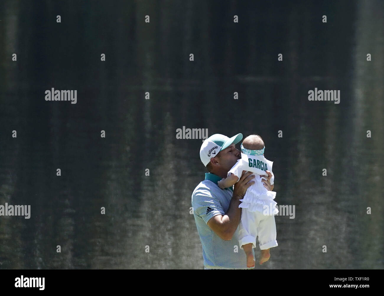 Sergio Garcia of Spain kisses daughter Azalea Adele Garcia at the Par 3