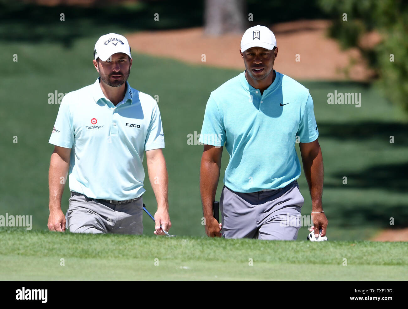 Tiger Woods And Kevin Kisner Walk To The 7th Green At Practice On The Wednesday Before The 2019 Masters Tournament At Augusta National Golf Club In Augusta Georgia On April 10 2019