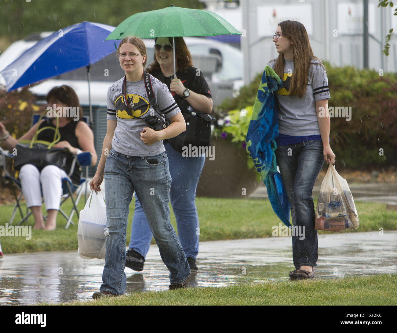 Two young women early arrivals wear Batman T Shirts during a prayer vigil in front of the municipal center in Aurora Colorado on July 22 2012. Twelve moviegoers were shot and killed with