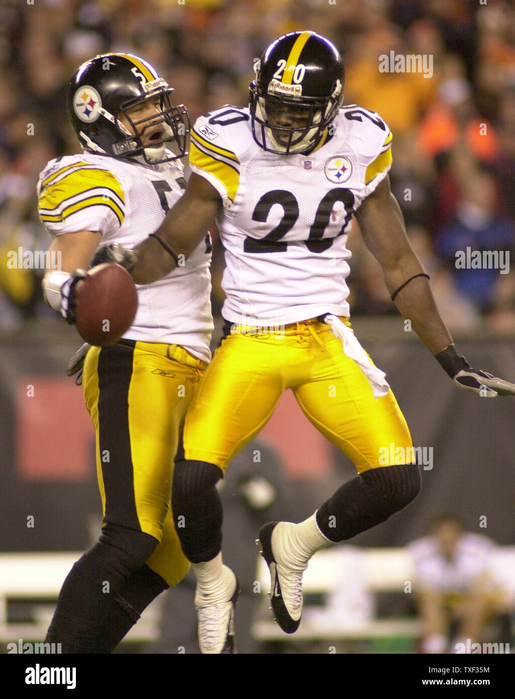 Pittsburgh Steelers James Farrior (51) celebrates his interception with  Steelers Bryant McFadden (20) in the fourth quarter of the Steelers 31 to  17 win against the Cincinnati Bengals the AFC North Wildcard