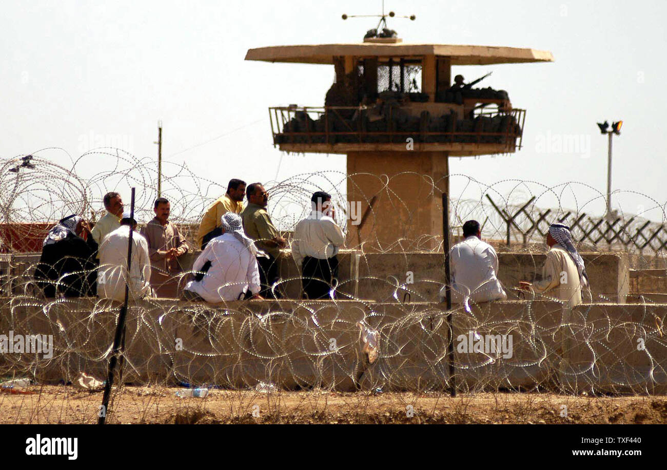 Hundreds of Iraqis gather outside of Abu Ghraib prison in Baghdad on May 4, 2004, looking for information about their relatives.    (UPI Photo/Hugo Infante) Stock Photo