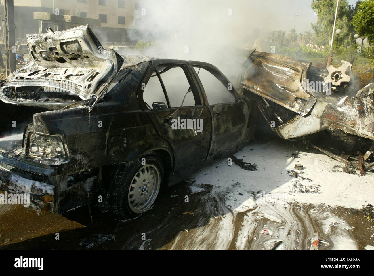 The aftermatch of a car bomb attack on Baghdad hotel complex that killed at least one and wounded four on May 25, 2005 in central Baghdad.  The bomb was placed inside one of the vehicles and was apparently intended for Australian embassy workers housed just meters away.   (UPI Photo/Mitch Prothero) Stock Photo