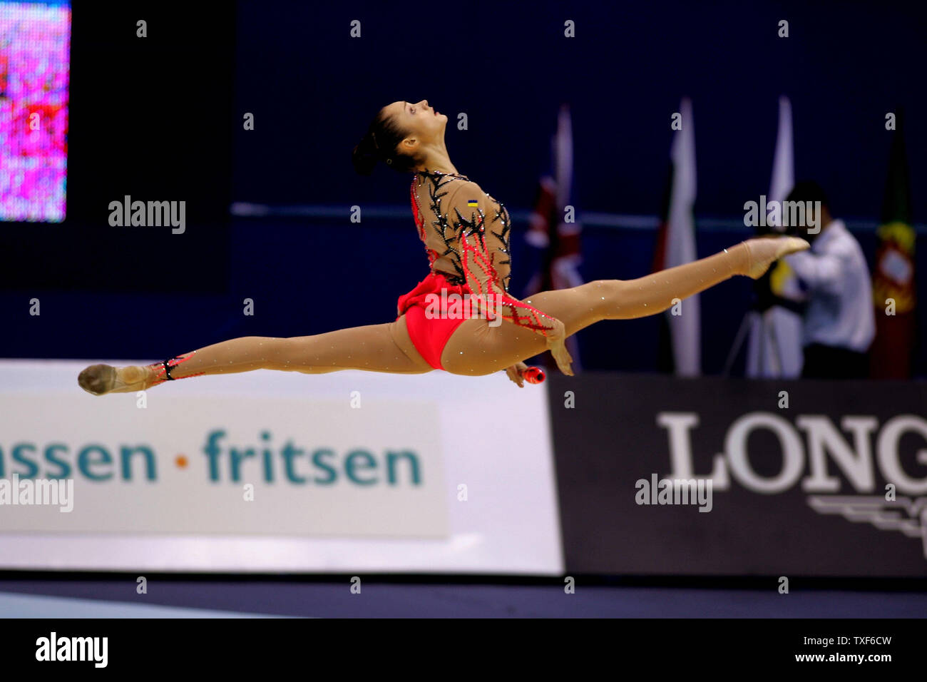 Anna Bessonova of Ukraine leaps to re-catch her clubs in rhythmic ...