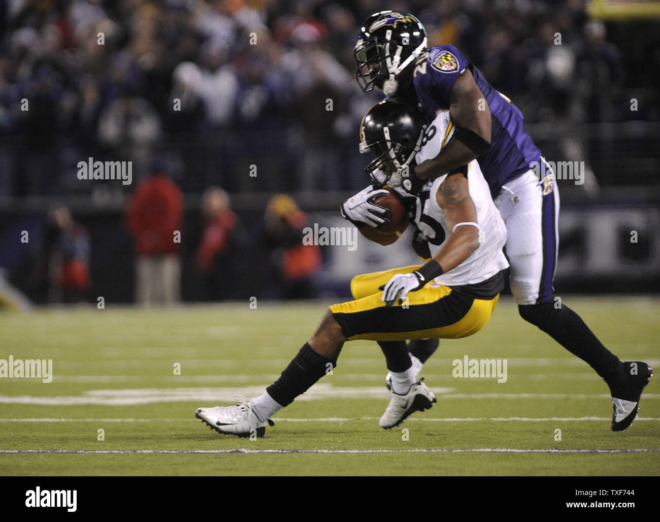 Pittsburgh Steelers wide receiver Hines Ward (86) is stopped by Baltimore Ravens safety Ed Reed after a 10 yard gain in the fourth quarter at M & T Bank Stadium in Baltimore, Maryland on December 14, 2008. The Steelers defeated the Ravens 13-9.  (UPI Photo/Kevin Dietsch) Stock Photo
