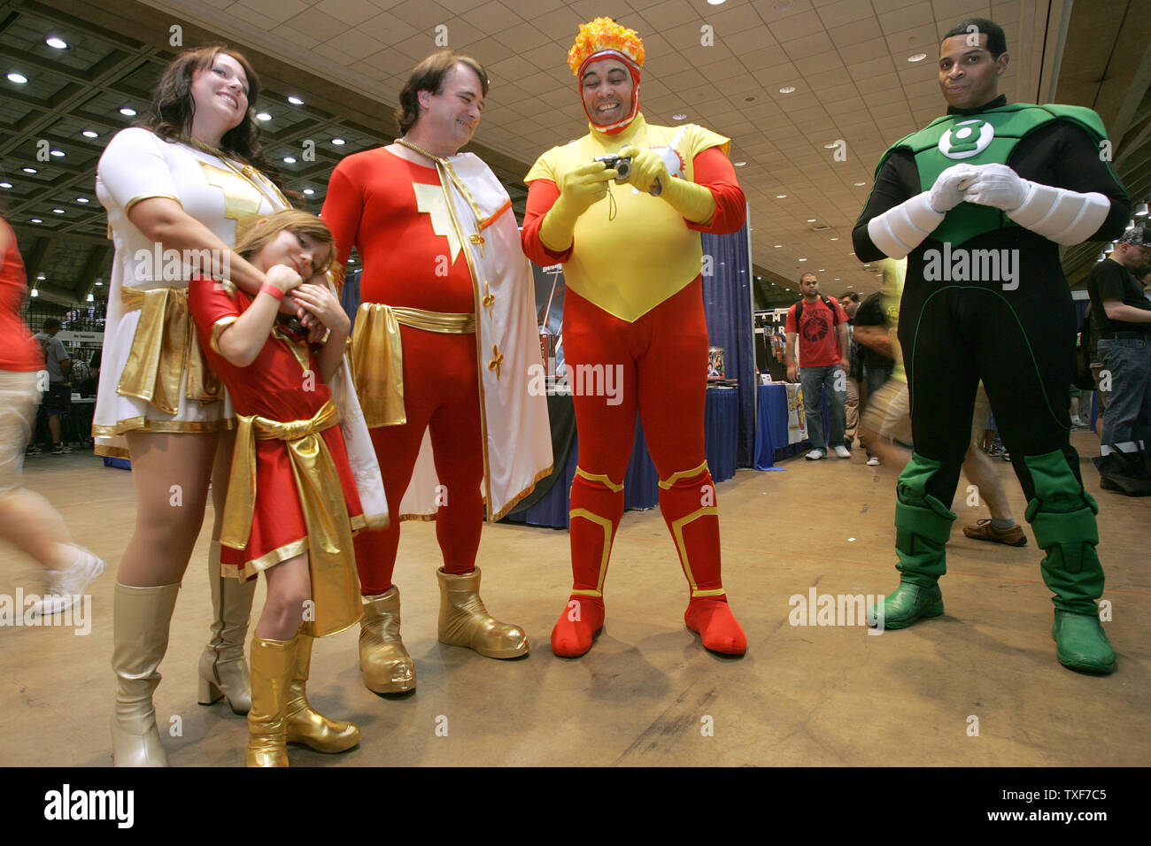 Wes, Natalie, and Ashley Barthlow, 9, from Smithsburg, Va, all dressed as the Marvel Family, chat with Eric Moran, of Philadelphia dressed as Firestorm, and Brian Gregory of Camden, NJ,  dressed as Greenlantern at the 11th annual Comic Con in Baltimore on August 29, 2010. Over 100 contestants showed off their best impressions of comic book heros and villains on costume contest day.  UPI/Greg Whitesell Stock Photo
