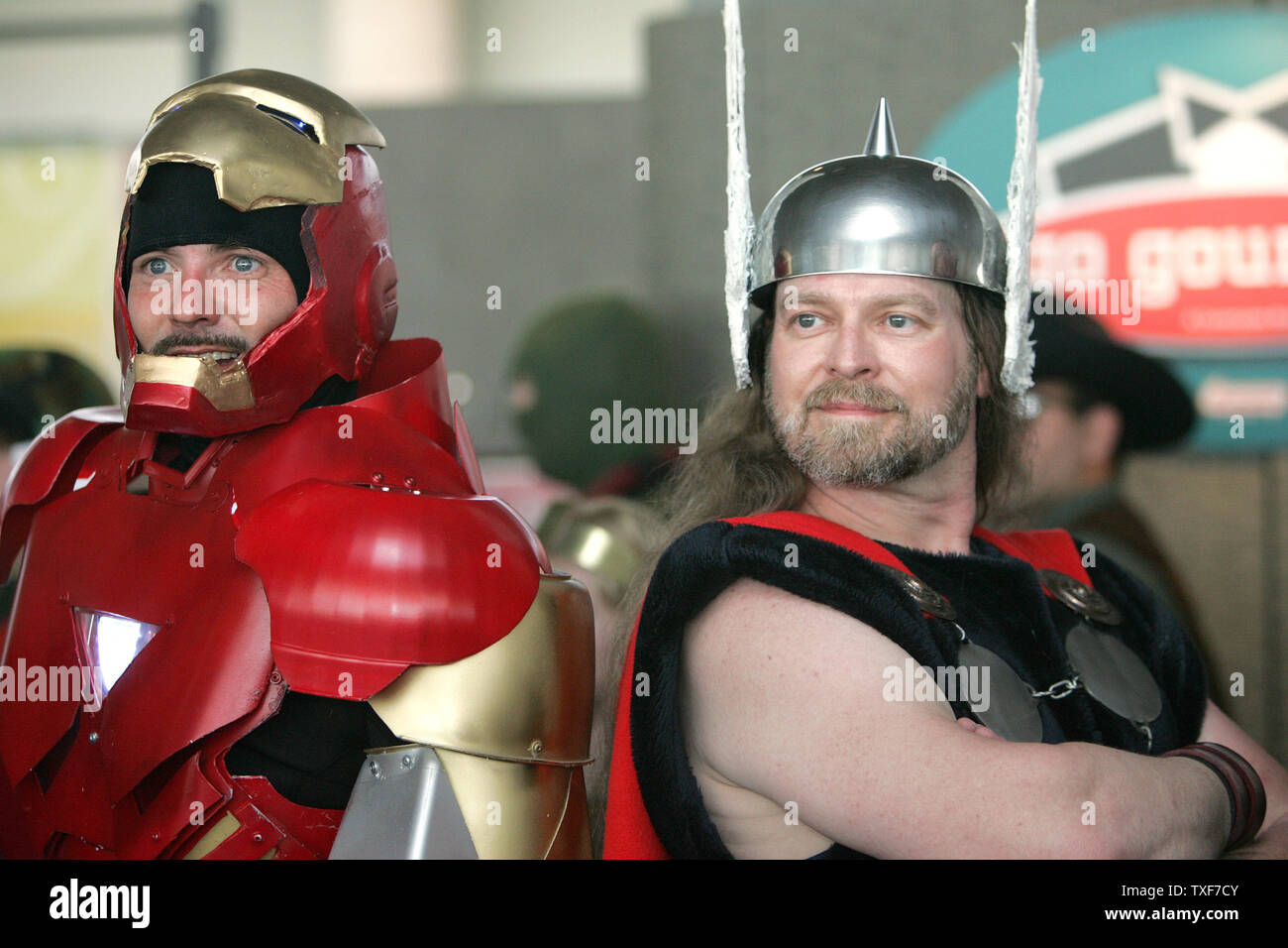 David Santiago (L) as Ares, God of War, and Garrett Gird, as Thor, wait  with others to be judged for the costume contest at the 11th annual Comic  Con in Baltimore on