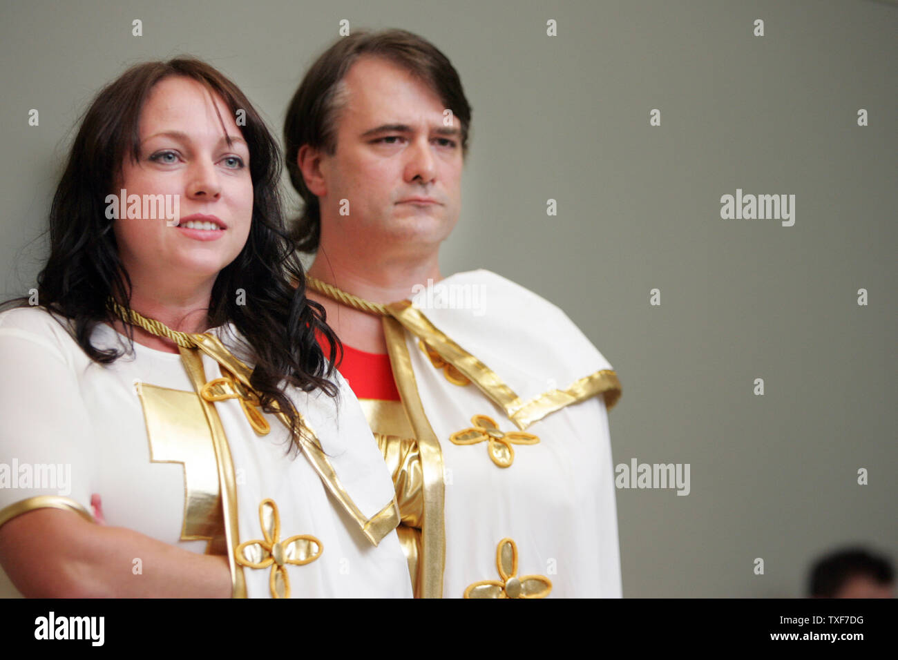 Natalie Barthlow and husband Wes Barthlow, from Smithsburg, Va, dressed as the Marvel Family, wait to be judged for the costume contest.   Over 100 contestants showed off their best impressions of comic book heros and villains on costume contest day at the 11th annual Comic Con in Baltimore on August 29, 2010.  UPI/Greg Whitesell Stock Photo