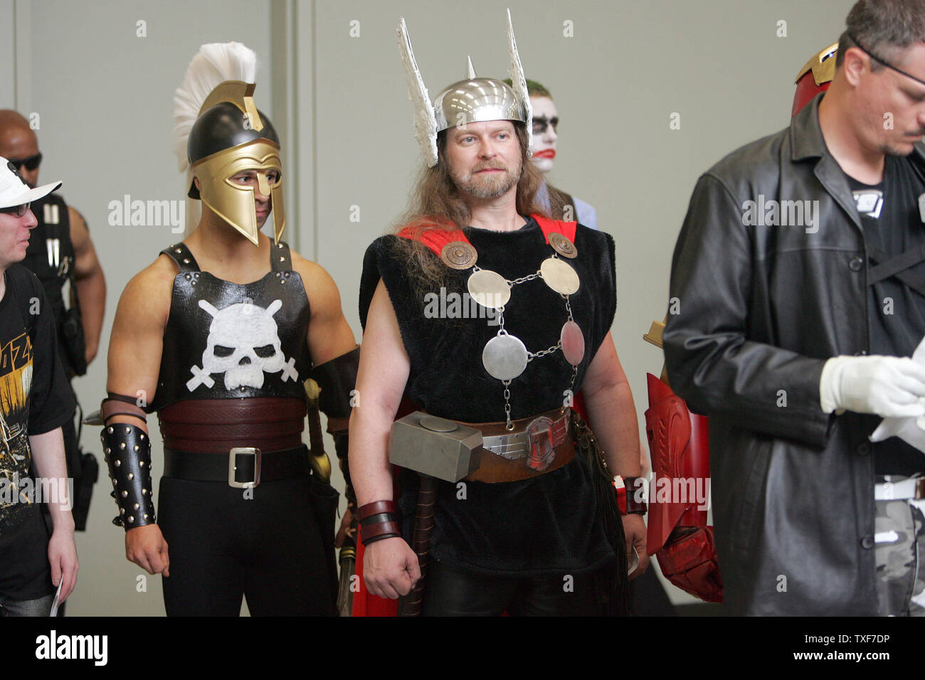 David Santiago (L) as Ares, God of War, and Garrett Gird, as Thor, wait with others to be judged for the costume contest at the 11th annual Comic Con in Baltimore on August 29, 2010.  Over 100 contestants showed off their best impressions of comic book heros and villains on costume contest day.   UPI/Greg Whitesell Stock Photo