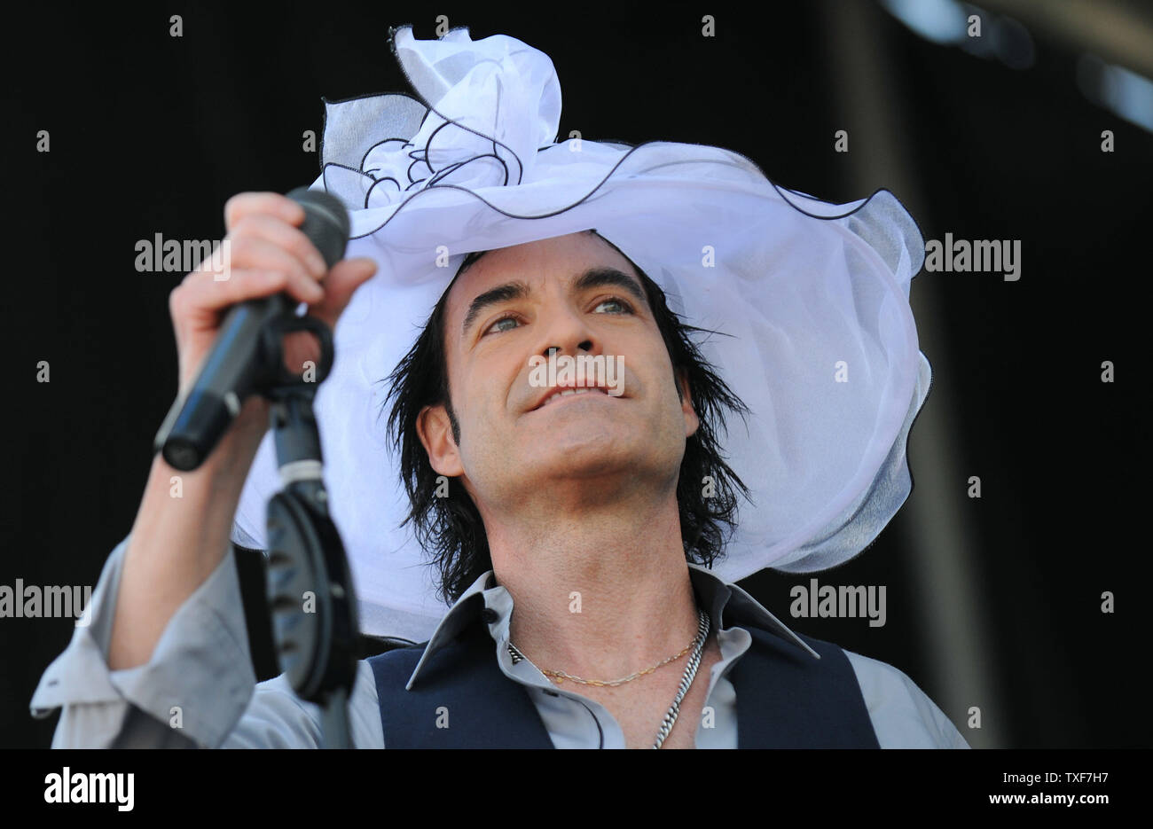 Patrick Monahan, the lead singer of Train, performs with his band in the infield prior to the