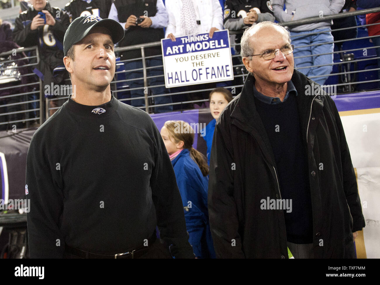 Baltimore Ravens Coach John Harbaugh walks onto the field with his