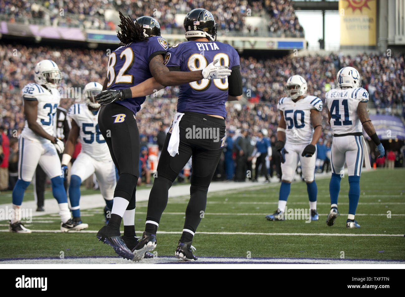 Baltimore Ravens tight end Dennis Pitta (R) celebrates with Torrey Smith after bringing in a 20-yard touchdown against the Indianapolis Colts during the third quarter at M&T Bank Stadium during the AFC Wild Card round in Landover, Maryland on January 6, 2013. The Ravens defeated the Colts 24-9. UPI/Kevin Dietsch Stock Photo