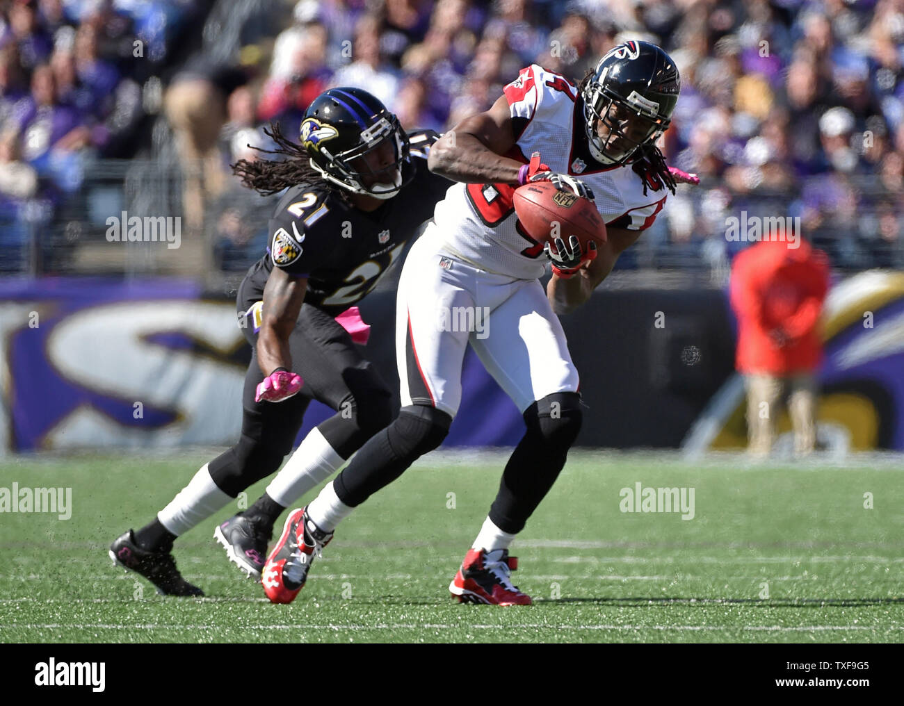 Atlanta Falcons wide receiver Roddy White brings in a pass against Baltimore Ravens cornerback Lardarius Webb at M&T Bank Stadium in Baltimore, Maryland on October 19, 2014.  UPI/Kevin Dietsch Stock Photo