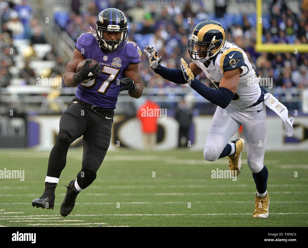 Baltimore Ravens running back Javorius Allen (37) is pushed by St