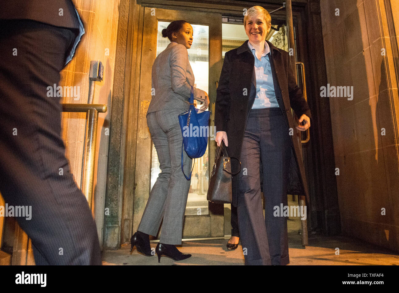 Janice Bledsoe, Deputy State's Attorney, (right) one of the prosecutors in the case against six Baltimore police officers charged in the death of Freddie Gray, leaves Baltimore City Circuit Courthouse at the end of the day in the trial of police Officer William G. Porter December 15, 2015 in Baltimore, Maryland. Porter is the first of six officers to be tried in Gray's death from a neck injury sustained while in police custody. Marilyn Mosby, Baltimore City state's attorney, said the death of Freddie Gray was a homicide and that his arrest was illegal. Gray, 25, died a week after suffering a s Stock Photo